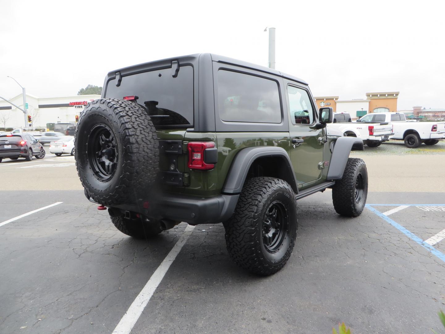 2021 Sarge Green /BLACK Jeep Wrangler Rubicon (1C4HJXCN4MW) with an 2.0L L4 DOHC 16V TURBO engine, 6A transmission, located at 2630 Grass Valley Highway, Auburn, CA, 95603, (530) 508-5100, 38.937893, -121.095482 - Rubicon featuring a Mopar suspension system, Fox shocks, 17" Fuel Wheels, BFG KO2 tires, Maxximus 3 front bumper stinger, Dual exhaust, Bolt hitch lock, Mopar HD tailgate hinge, and a custom cargo platform. - Photo#4